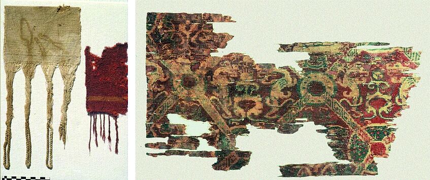 Links: Lokale Leinen- und Wollgewebe mit Fransen (1.-2. Jh. n. Chr.) Rechts: chinesischer Seidenstoff mit stilisierten Drachen und Fabelwesen (1. Jh. n. Chr.)